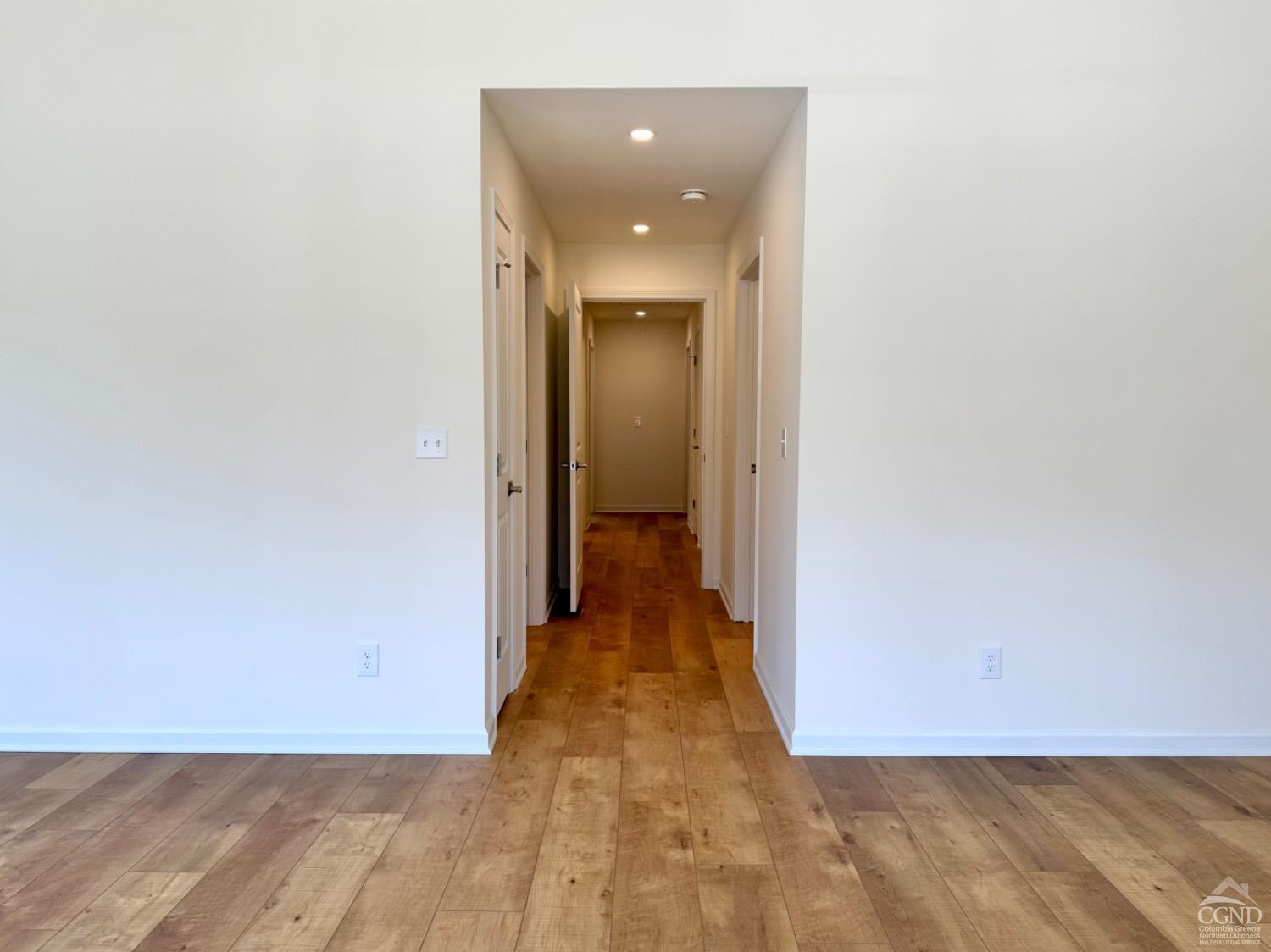 29 Marina Drive Catskill, NY 12414 - Photo 12 of 28 a view of a hallway with wooden floor and a bathroom