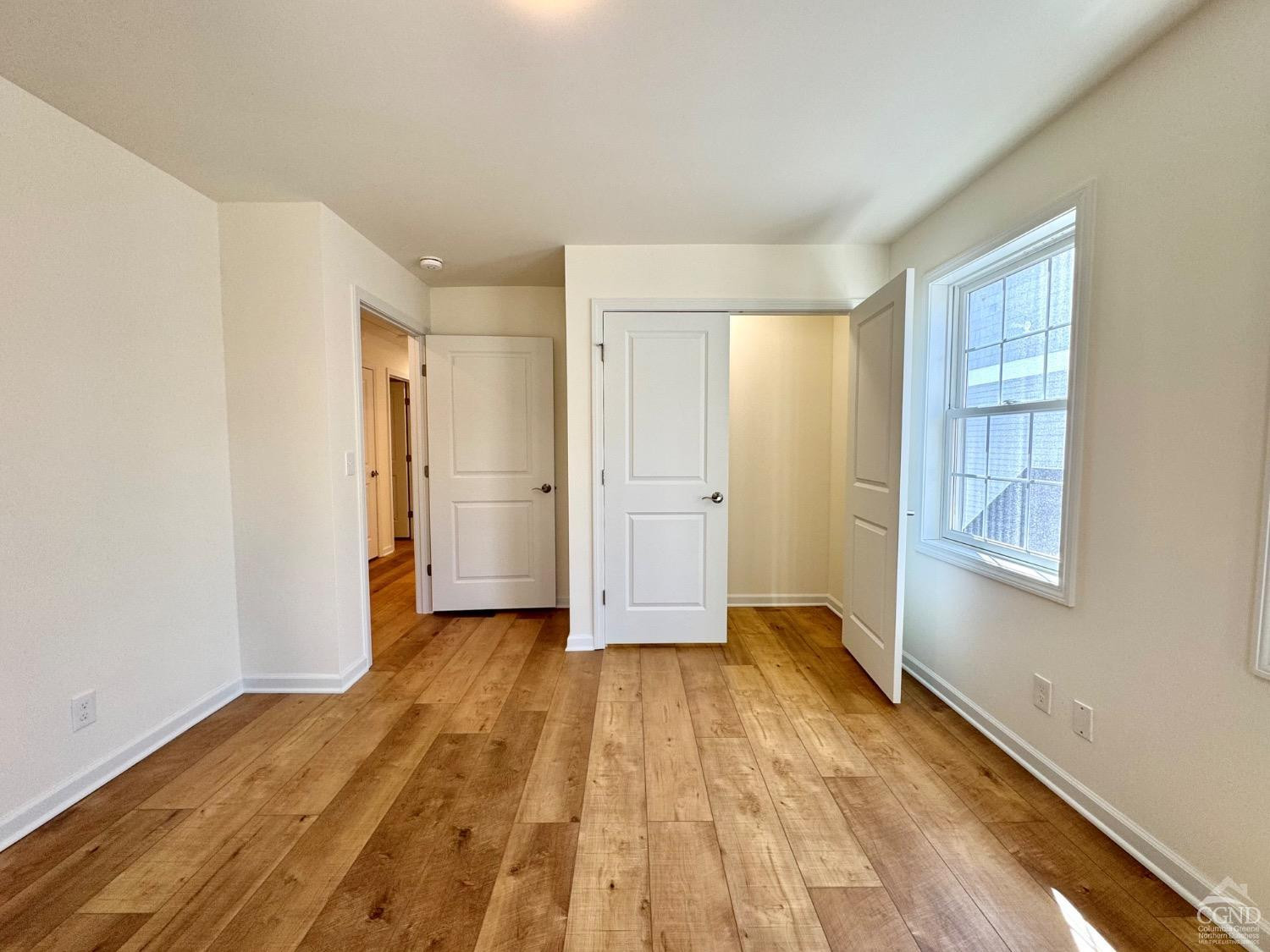 29 Marina Drive Catskill, NY 12414 - Photo 17 of 28 a view of empty room with wooden floor and fan