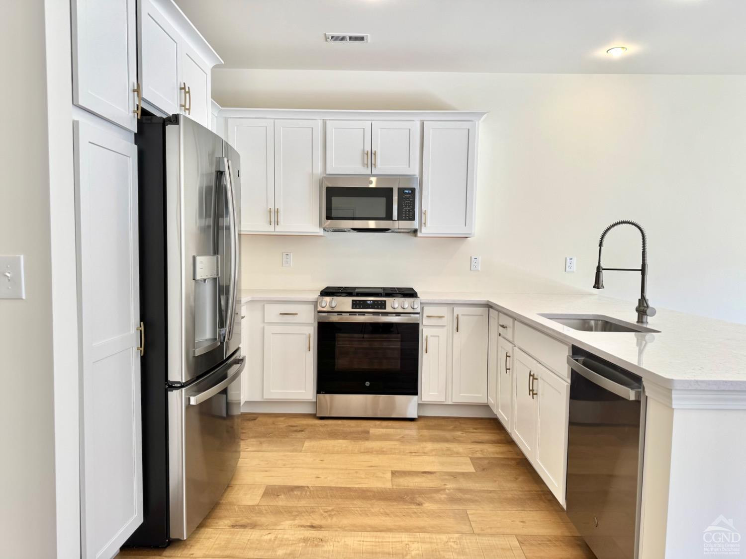 29 Marina Drive Catskill, NY 12414 - Photo 5 of 28 a kitchen with stainless steel appliances granite countertop a refrigerator stove and sink