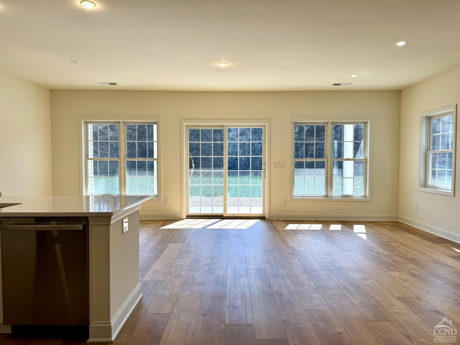 29 Marina Drive Catskill, NY 12414 - Photo 7 of 28 an empty room with wooden floor and windows