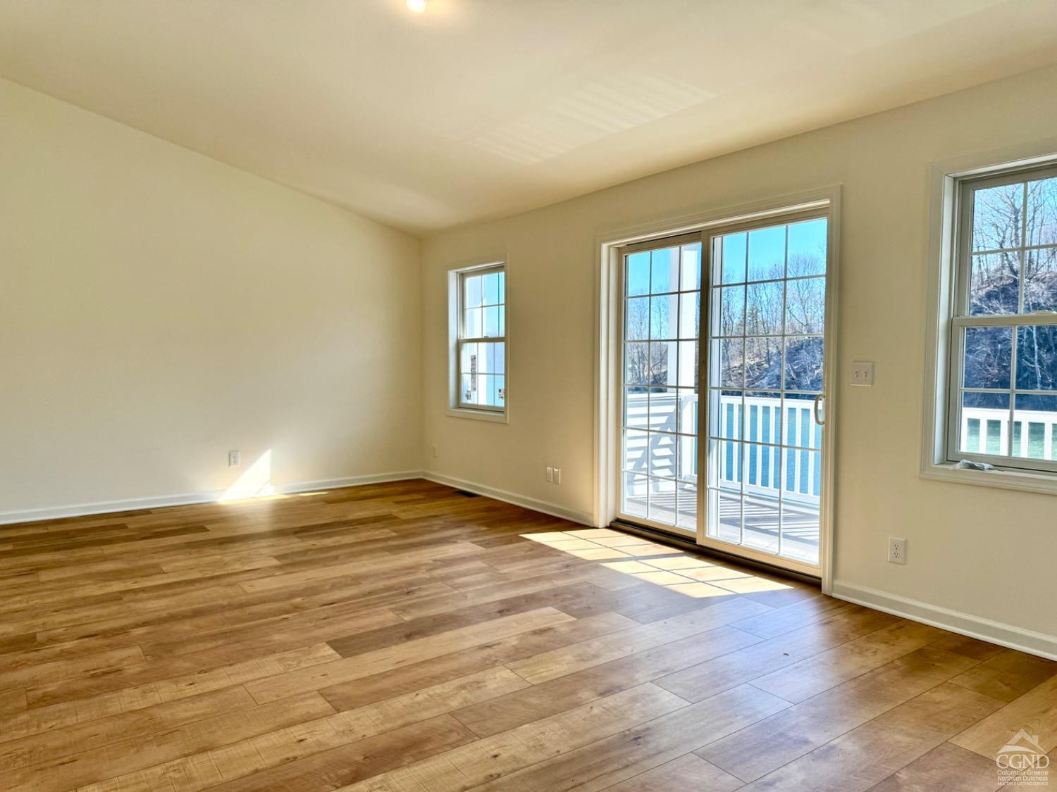 29 Marina Drive Catskill, NY 12414 - Photo 10 of 28 a view of an empty room with wooden floor and a window