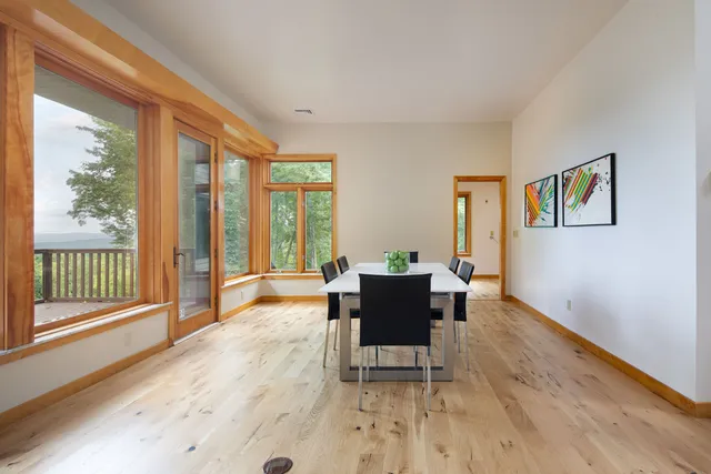 a view of a livingroom with furniture and wooden floor