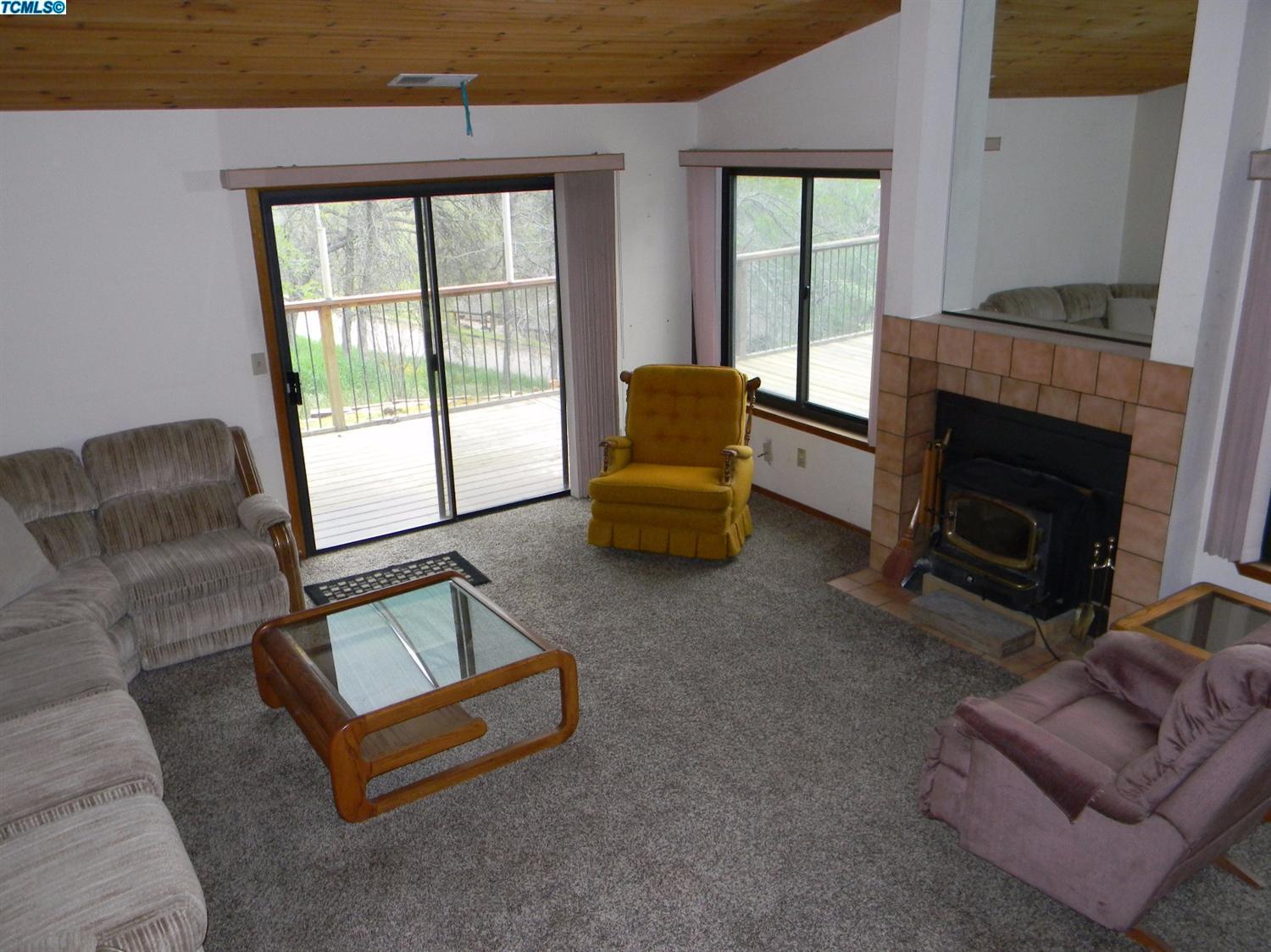 40675 Crystal Drive Three Rivers, CA 93271 - Photo 19 of 34 a living room with furniture and a fireplace
