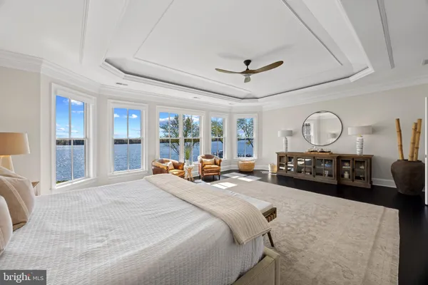 a living room with a bed furniture and a window
