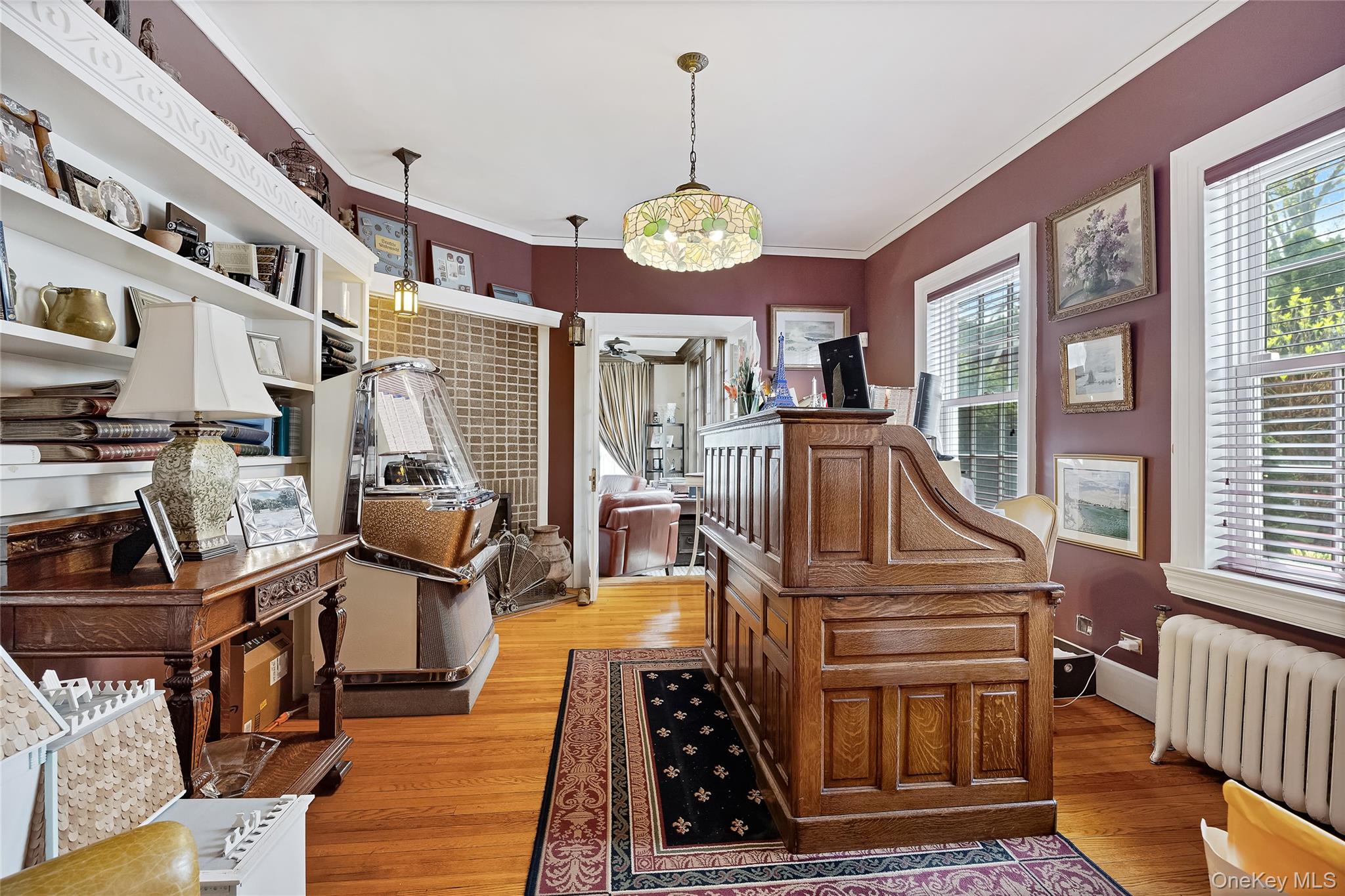 1-27 Beverly Road Queens, NY 11363 - Photo 38 of 46 a view of a dining room with furniture a chandelier and wooden floor