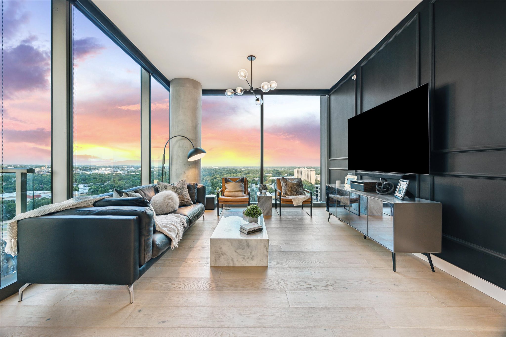 44 East Avenue, Unit 1607 Austin, TX 78701 - Photo 1 of 19 a living room with couches and a flat screen tv