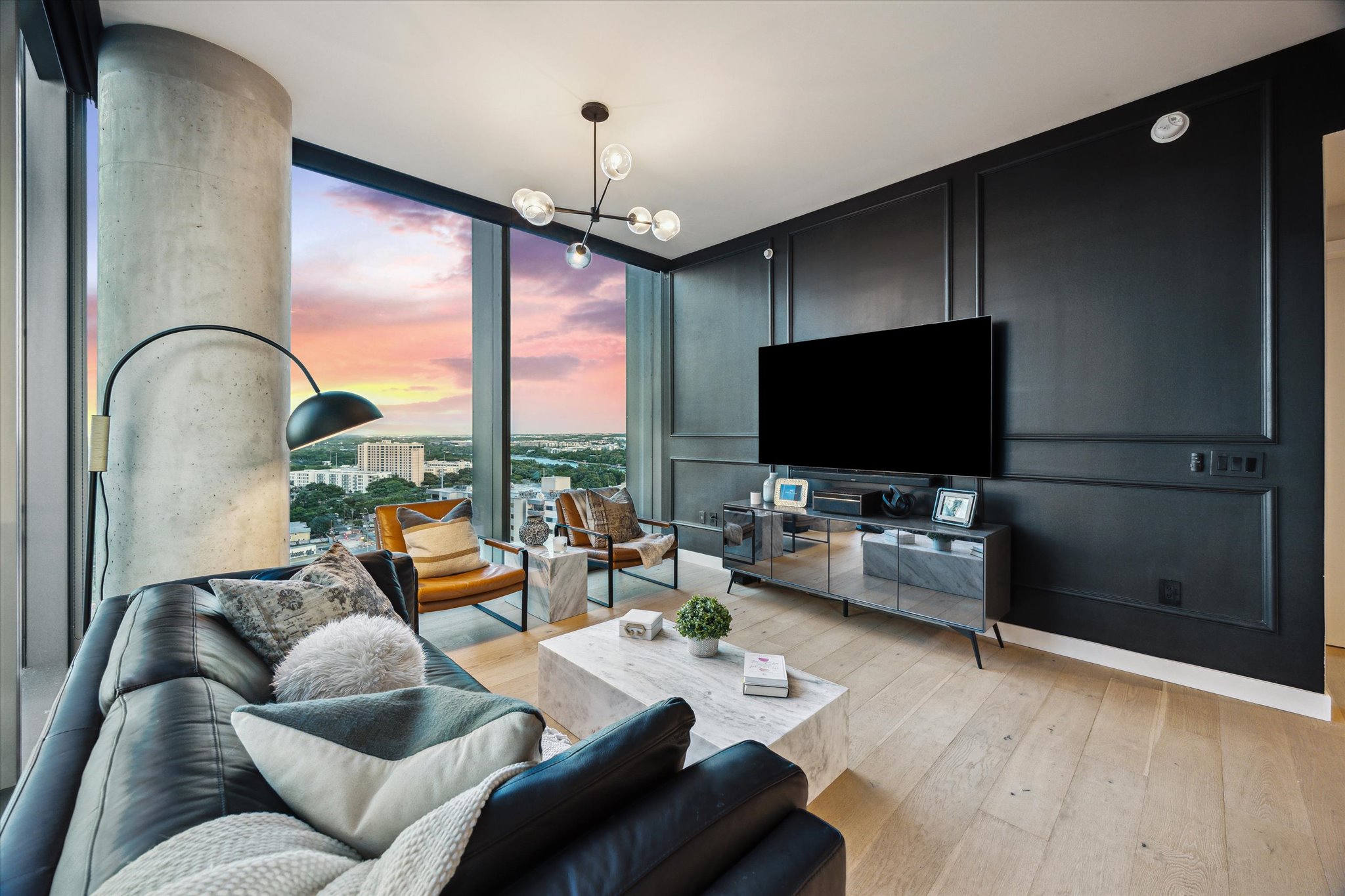 44 East Avenue, Unit 1607 Austin, TX 78701 - Photo 3 of 19 a living room with furniture and a flat screen tv