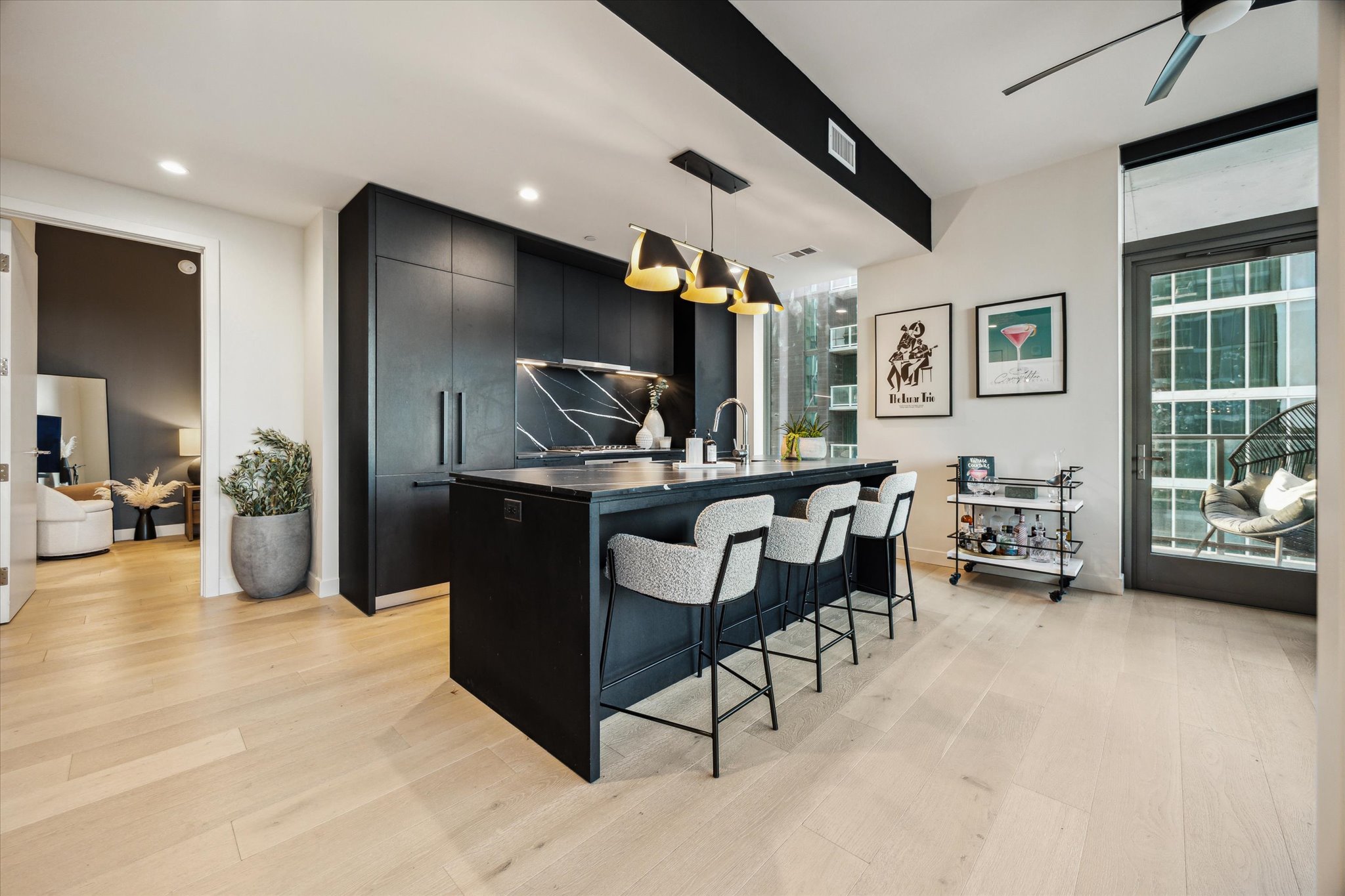 44 East Avenue, Unit 1607 Austin, TX 78701 - Photo 5 of 19 a living room with furniture and a flat screen tv