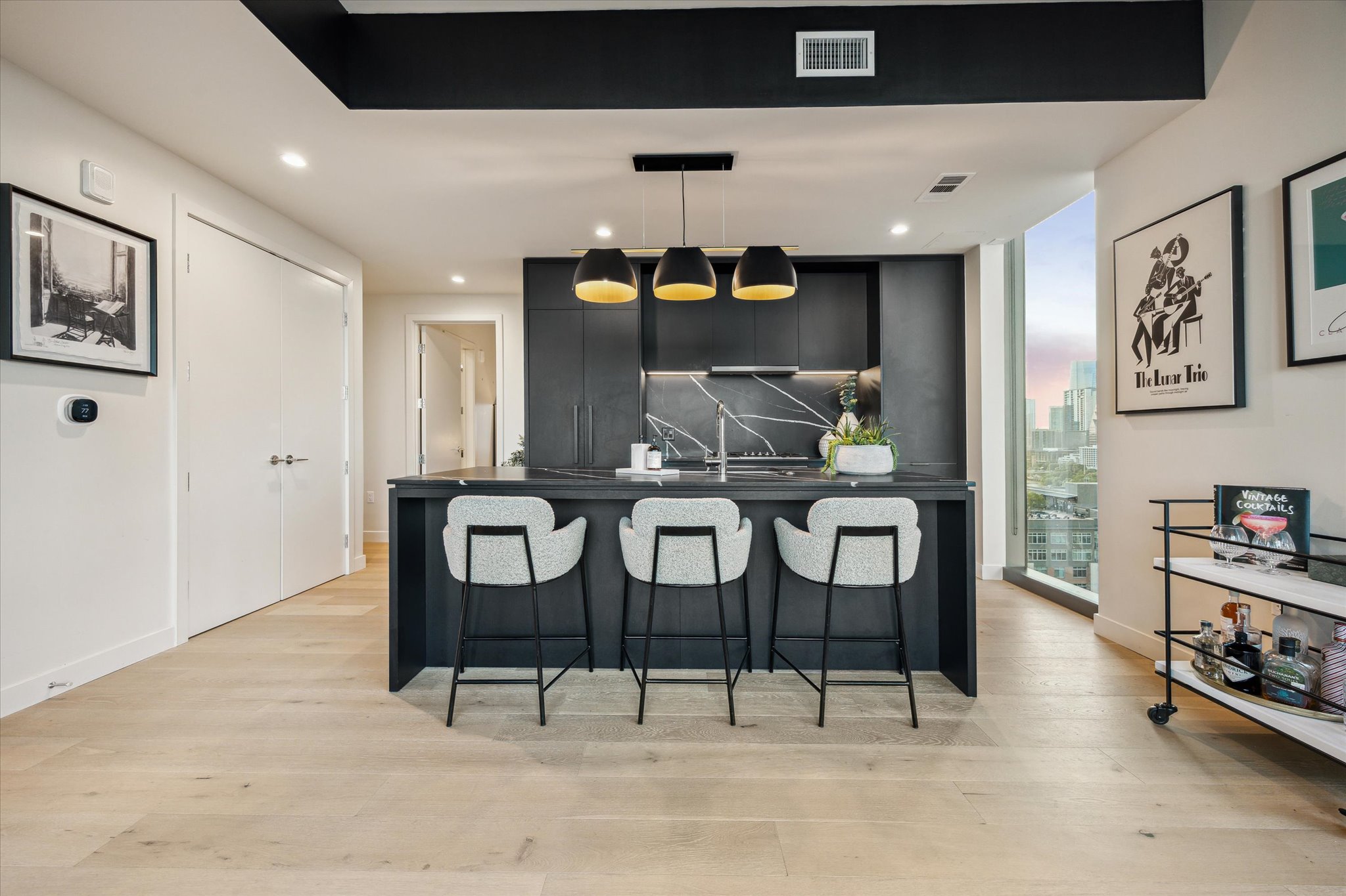 44 East Avenue, Unit 1607 Austin, TX 78701 - Photo 7 of 19 a view of a dining room with furniture and wooden floor