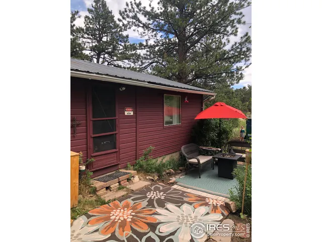 a view of a backyard with sitting area