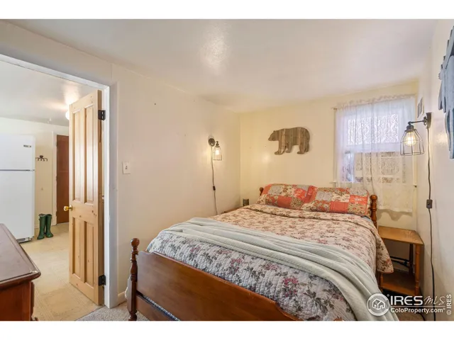 a bedroom with a bed and a cabinets