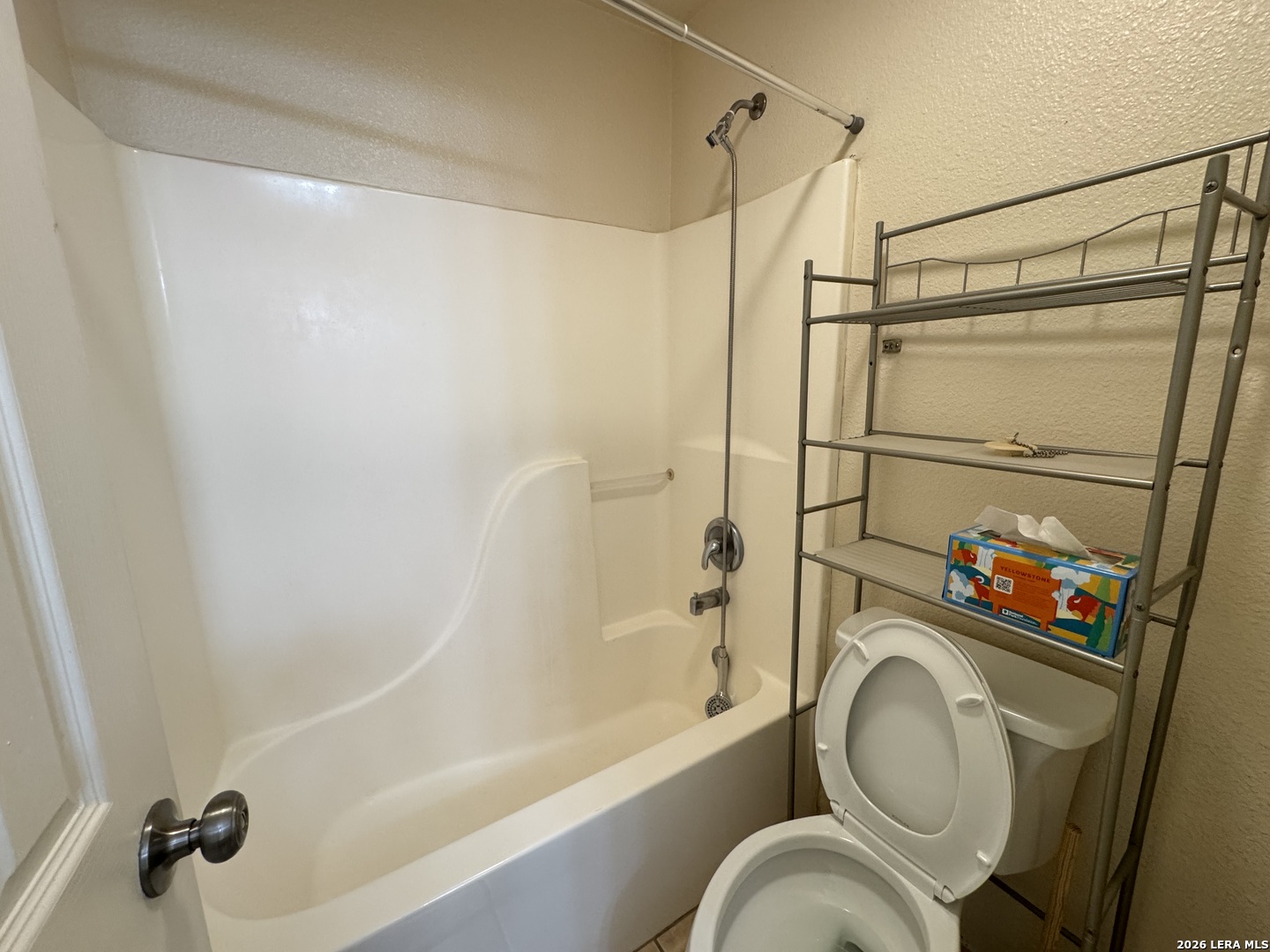 7921 M G Road San Antonio, TX 78251 - Photo 7 of 10 a bathroom with a toilet and a shower