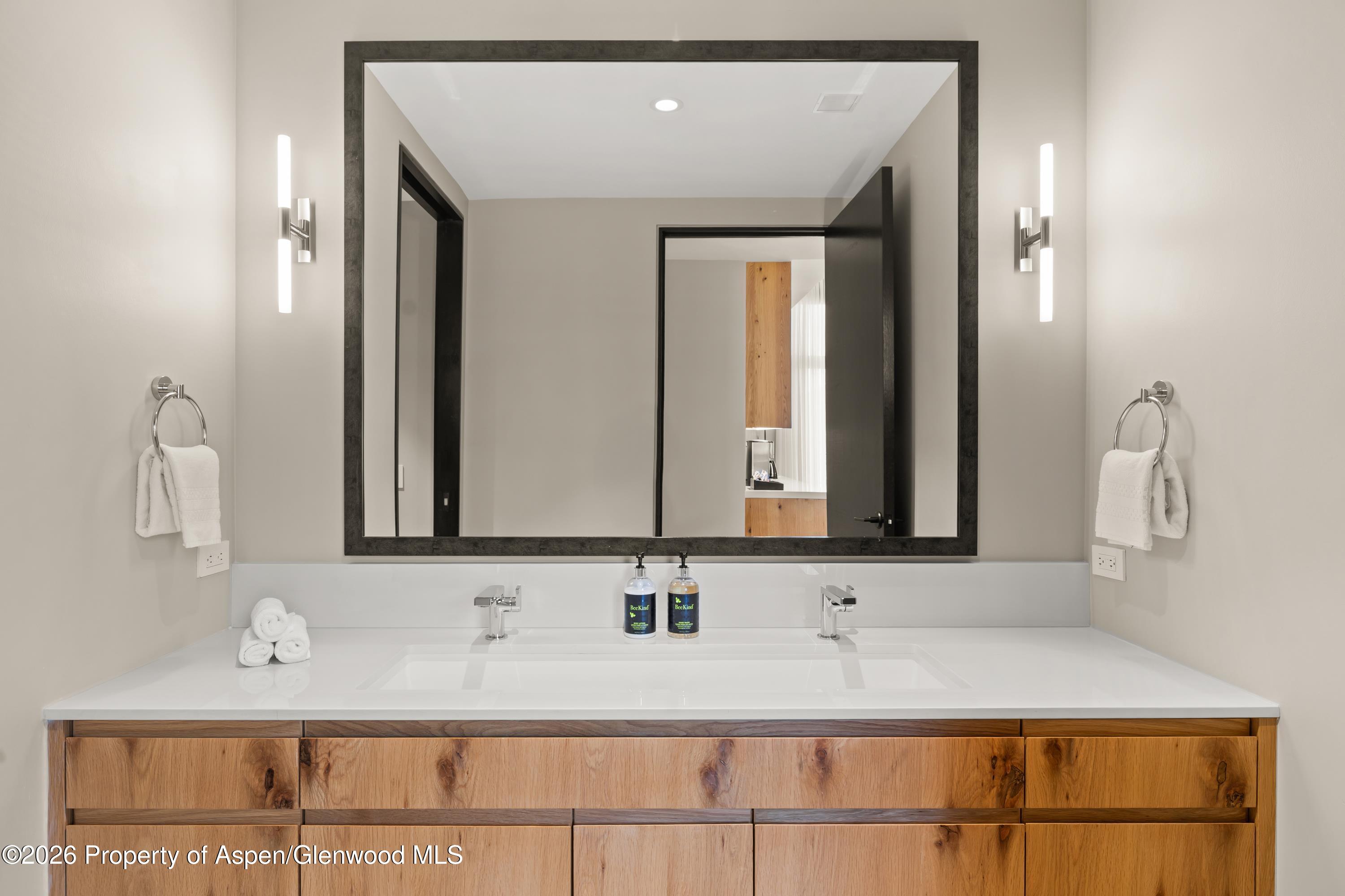 77 Wood Road, Unit 703 EAST Snowmass Village, CO 81615 - Photo 15 of 21 a bathroom with a sink and a mirror
