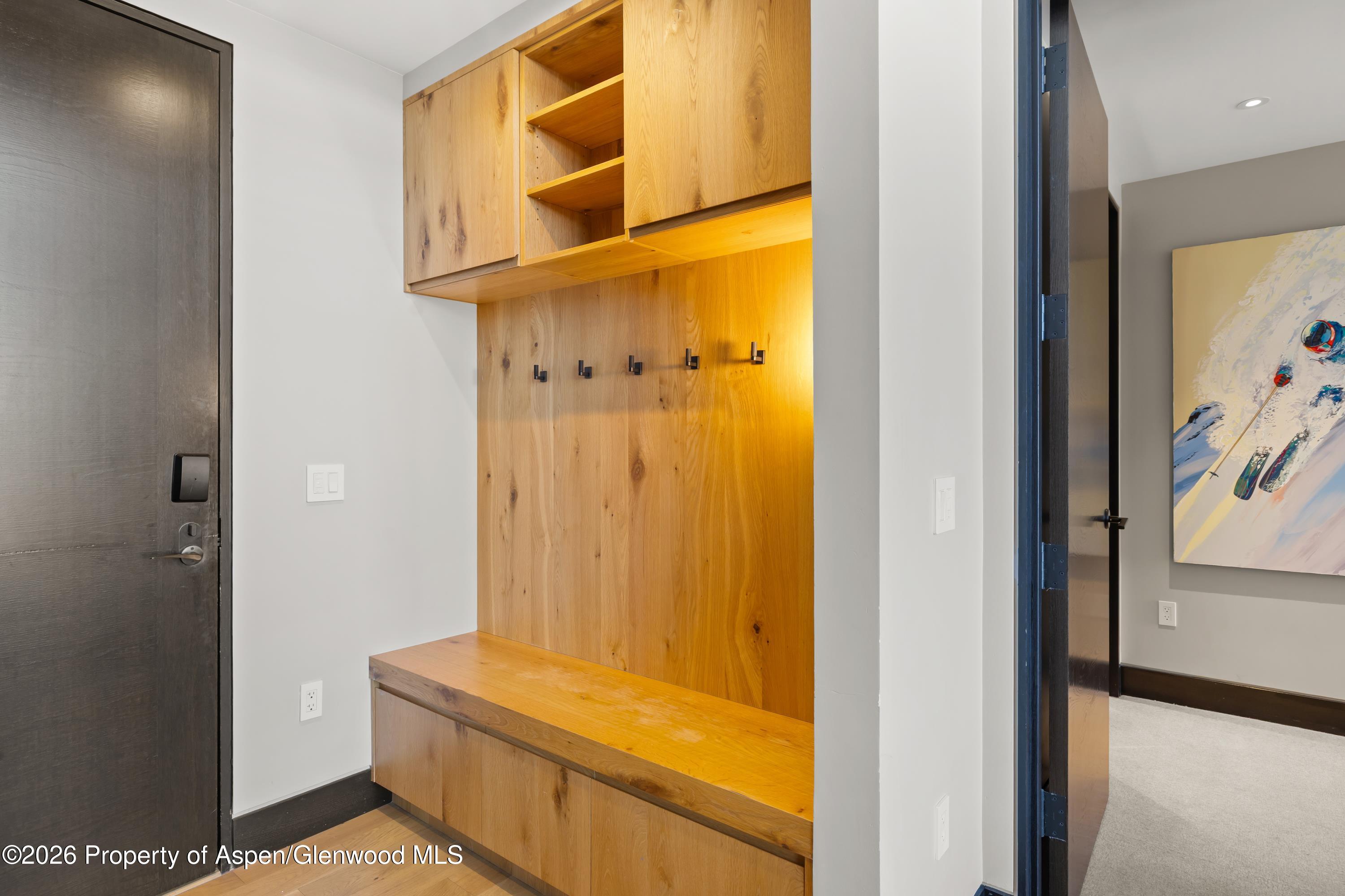 77 Wood Road, Unit 703 EAST Snowmass Village, CO 81615 - Photo 17 of 21 hallway view with wooden floor