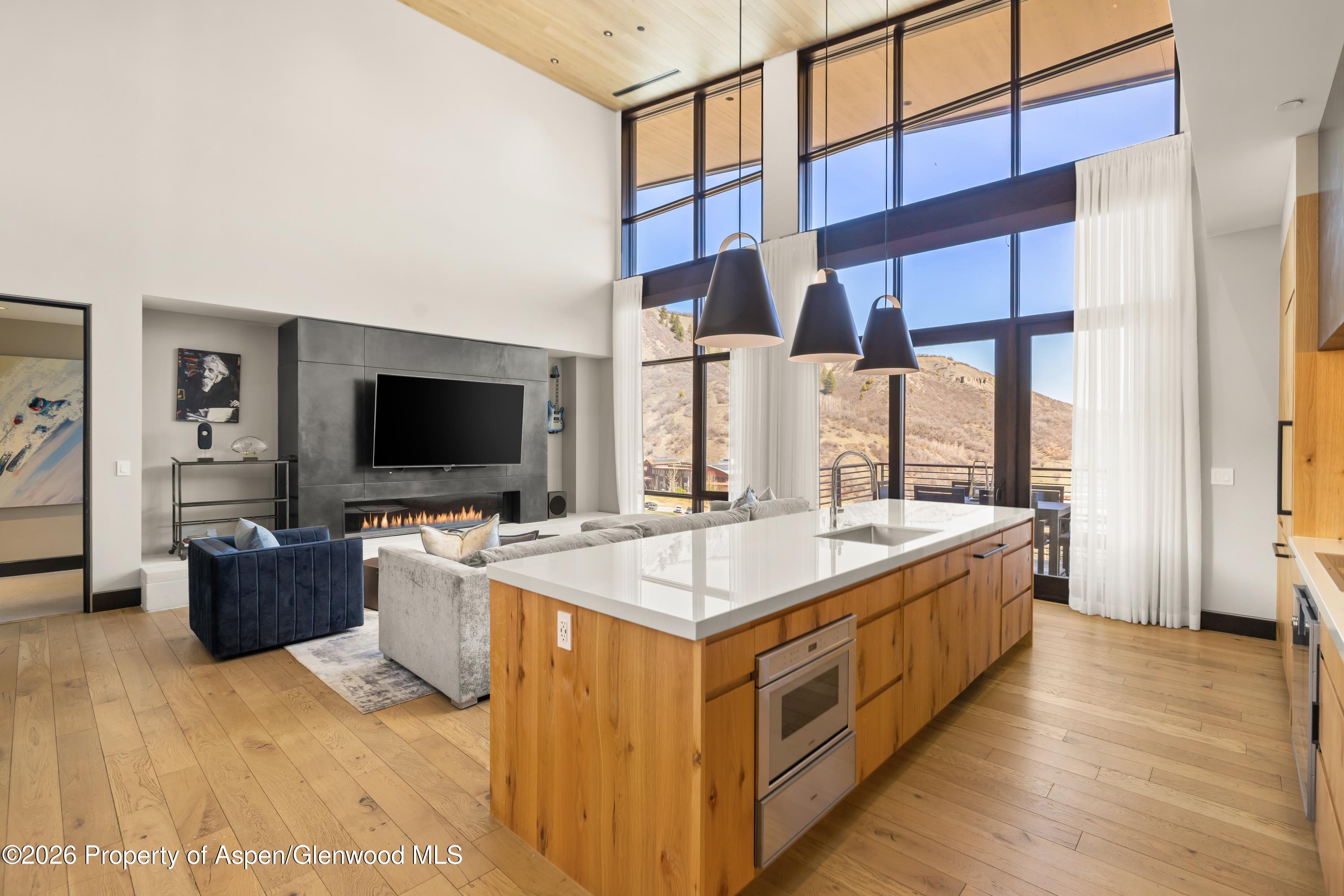 77 Wood Road, Unit 703 EAST Snowmass Village, CO 81615 - Photo 4 of 21 a large white kitchen with a large window