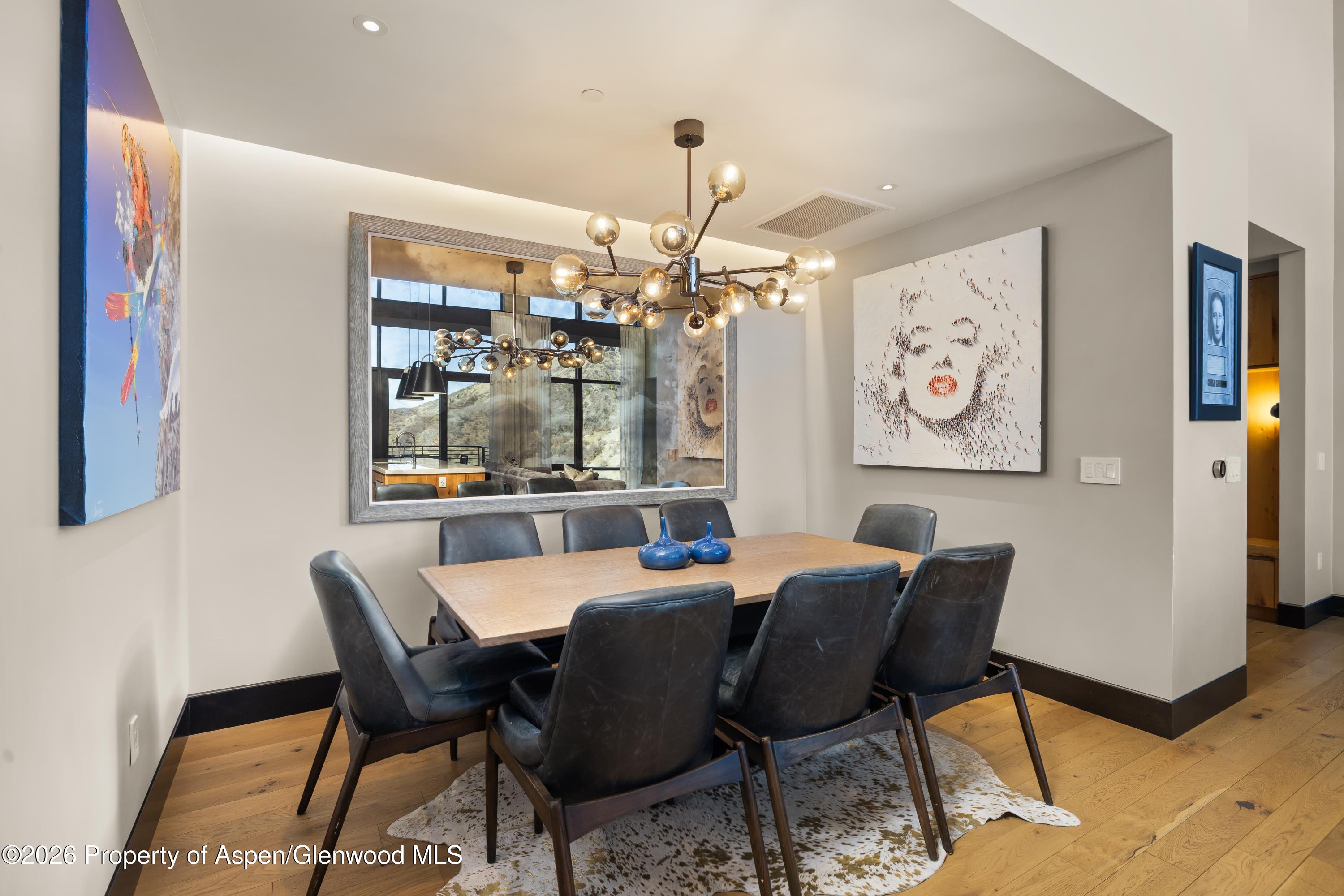 77 Wood Road, Unit 703 EAST Snowmass Village, CO 81615 - Photo 6 of 21 a dining room with furniture and window