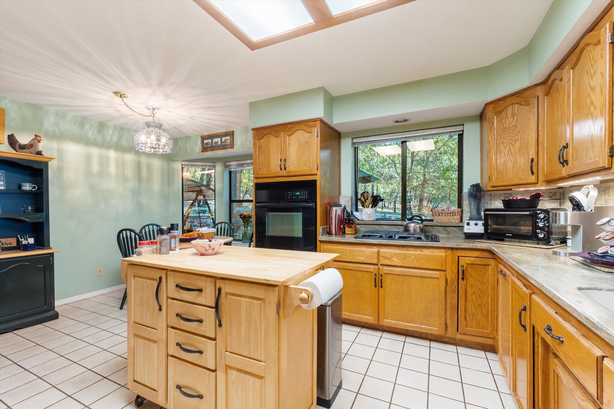 26997 Lookout Mountain Road Oak Run, CA 96069 - Photo 19 of 92 a kitchen with a stove a sink a refrigerator and a microwave