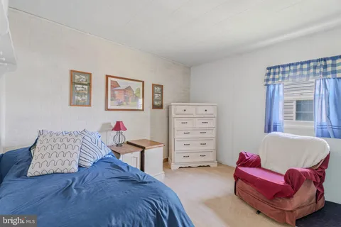 a bedroom with furniture and a bed