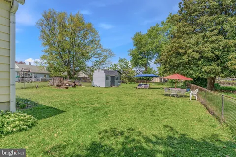 a view of a backyard with tree s
