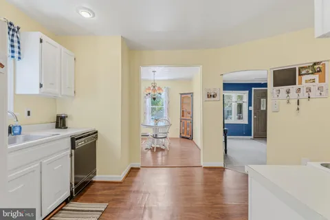 a view of a kitchen cabinets and wooden floor
