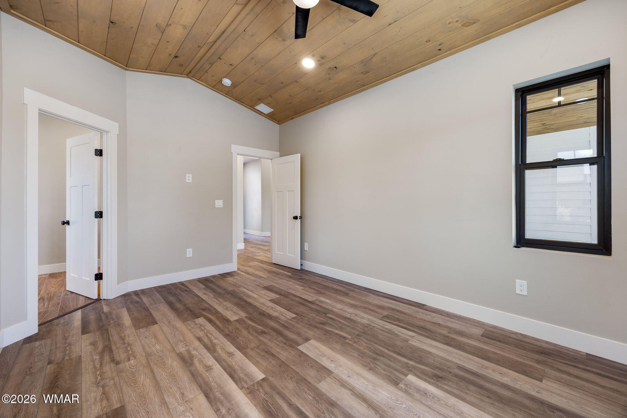 561 South Rock Ridge Drive Show Low, AZ 85901 - Photo 10 of 28 wooden floor in an empty room with a window