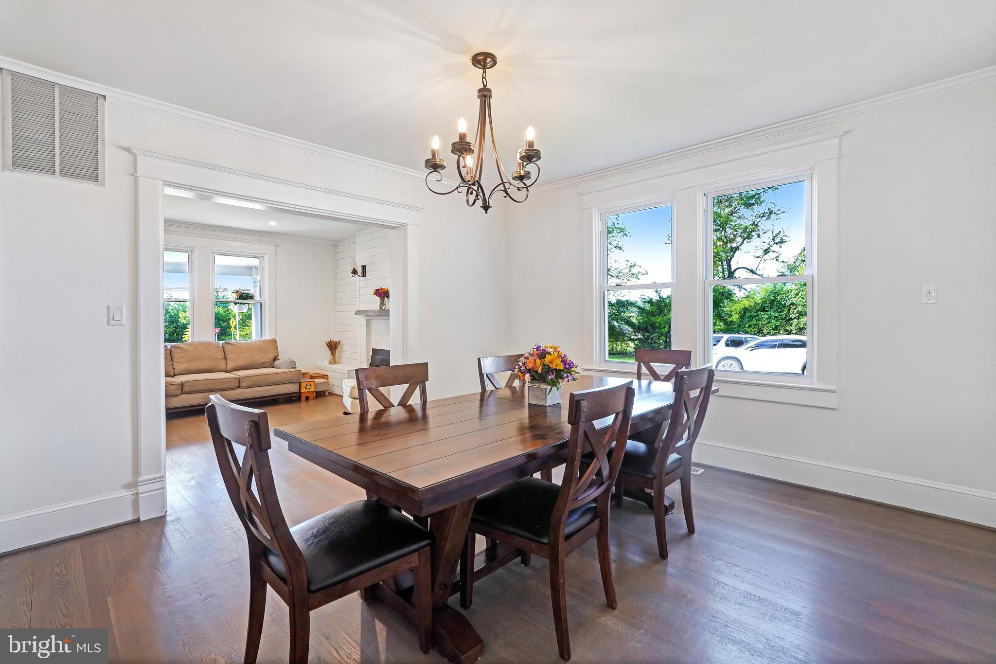 27100 Ridge Road Damascus, MD 20872 - Photo 15 of 74 a view of a dining room with furniture window and wooden floor