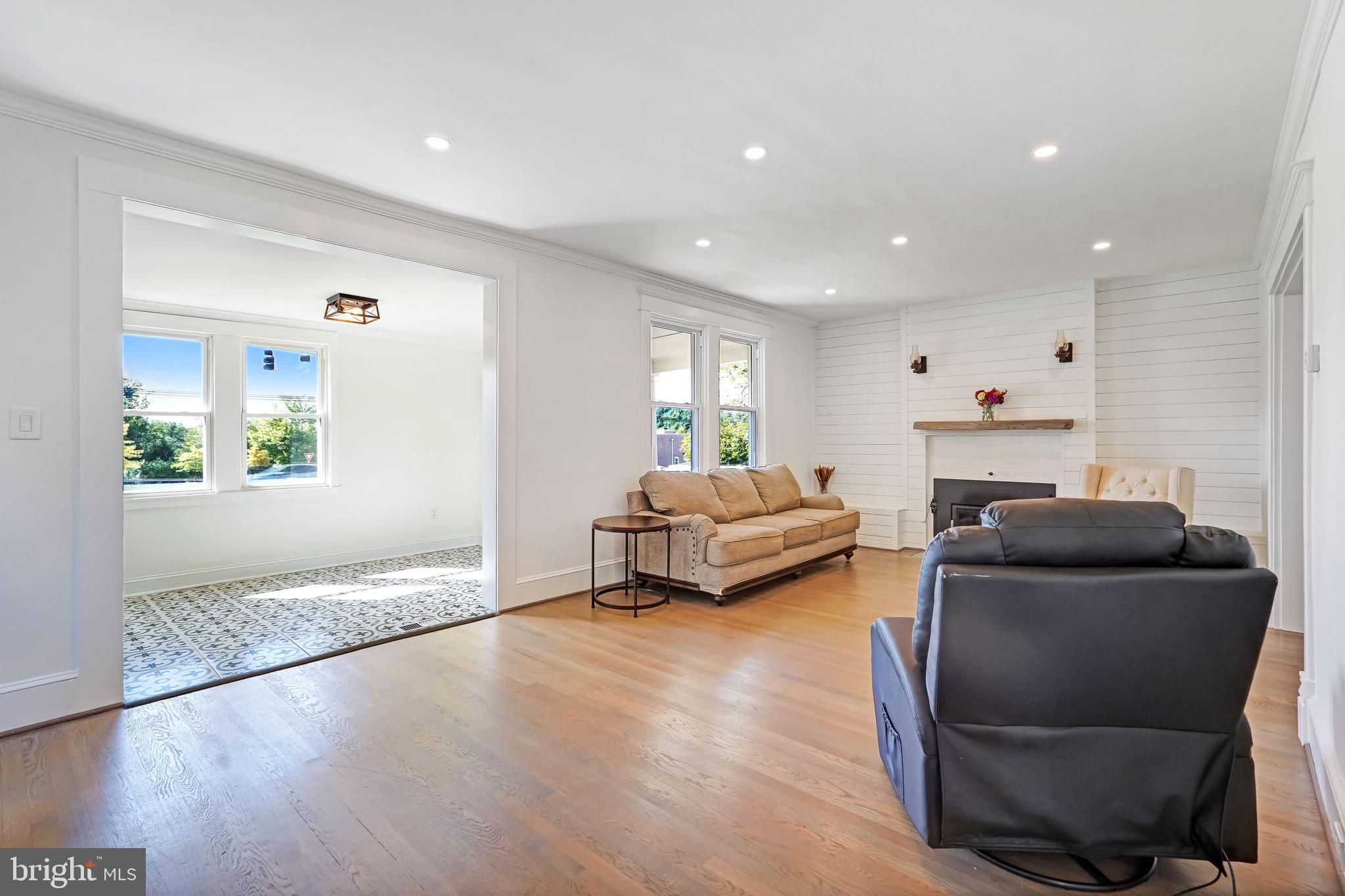 27100 Ridge Road Damascus, MD 20872 - Photo 18 of 74 a living room with furniture and a fireplace