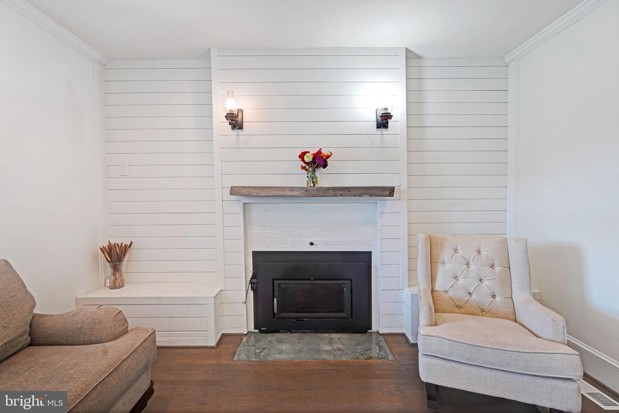 27100 Ridge Road Damascus, MD 20872 - Photo 20 of 74 a living room with furniture and a fireplace