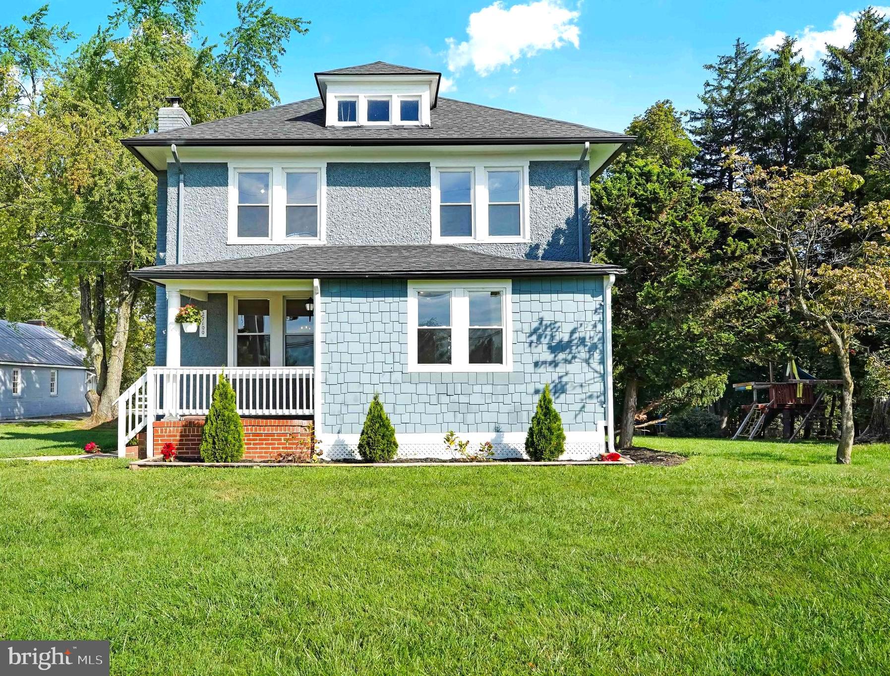 27100 Ridge Road Damascus, MD 20872 - Photo 2 of 74 a front view of house with yard and green space