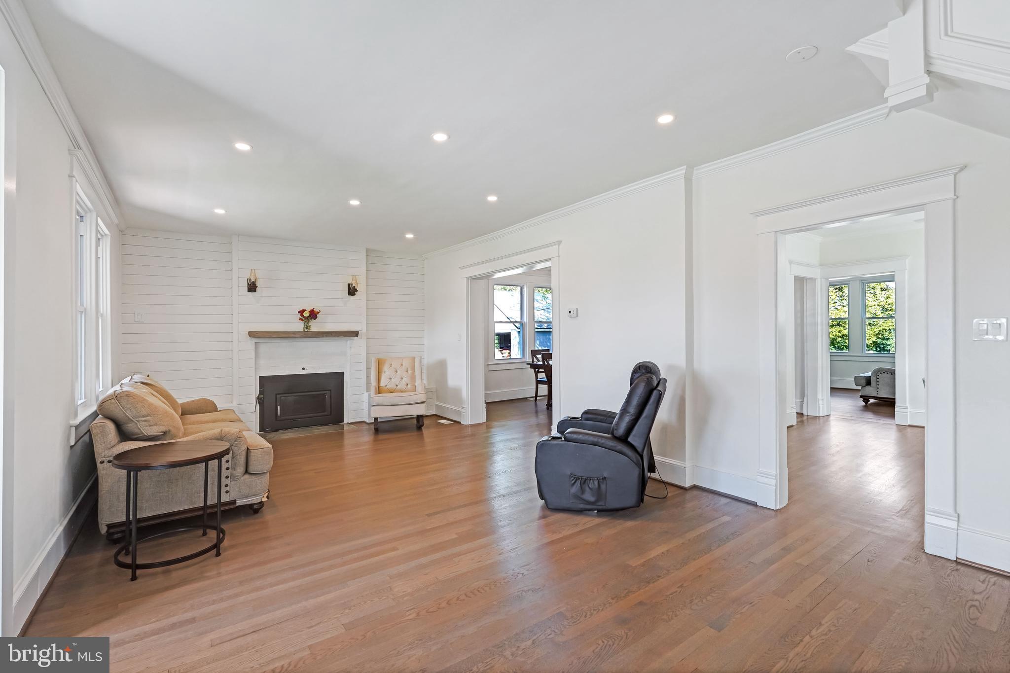 27100 Ridge Road Damascus, MD 20872 - Photo 22 of 74 a living room with furniture and a fireplace