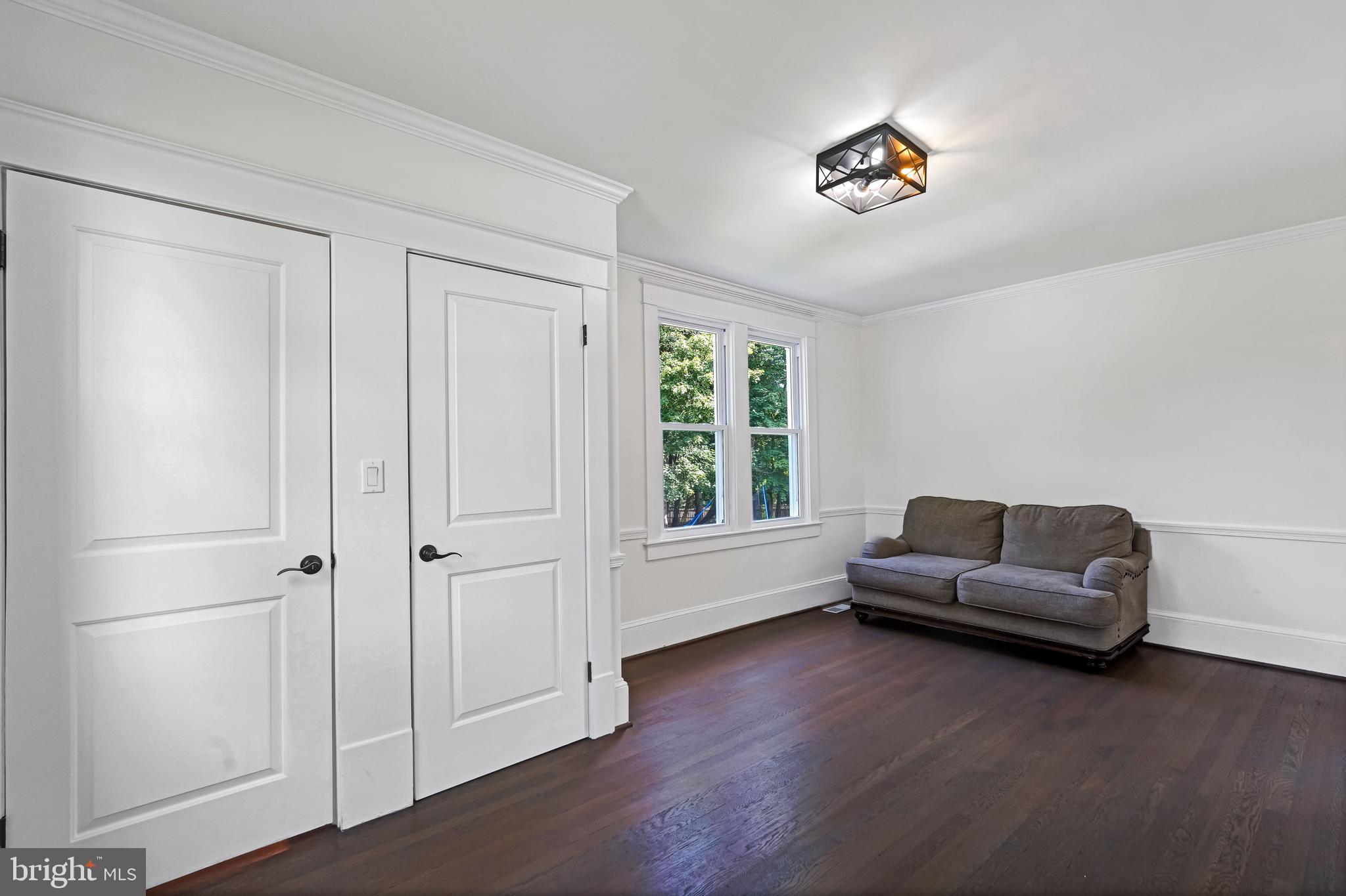 27100 Ridge Road Damascus, MD 20872 - Photo 23 of 74 a living room with furniture and a window