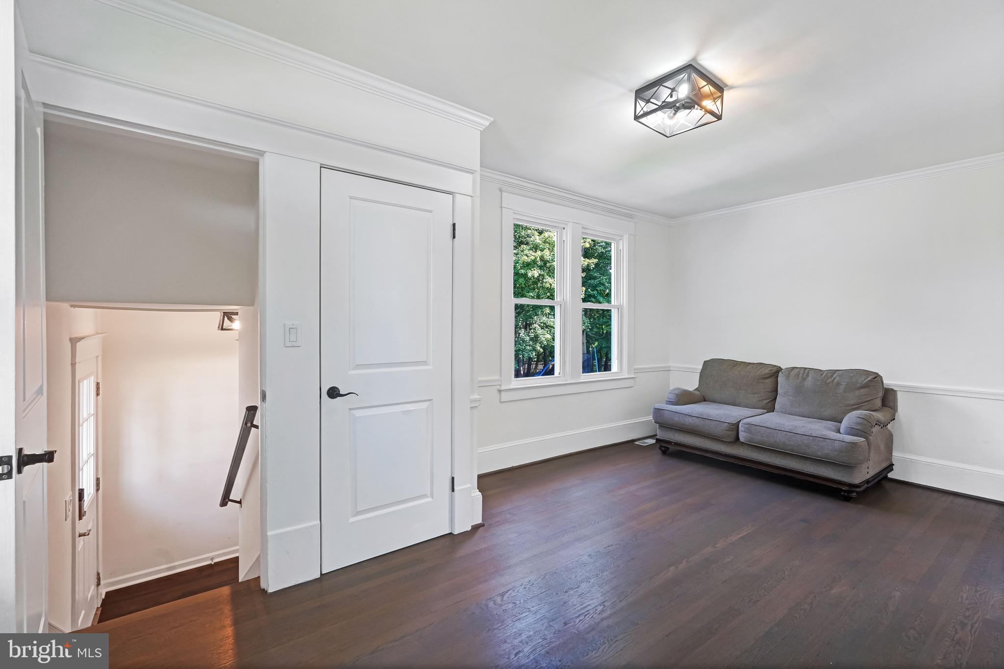 27100 Ridge Road Damascus, MD 20872 - Photo 24 of 74 a living room with furniture and a window