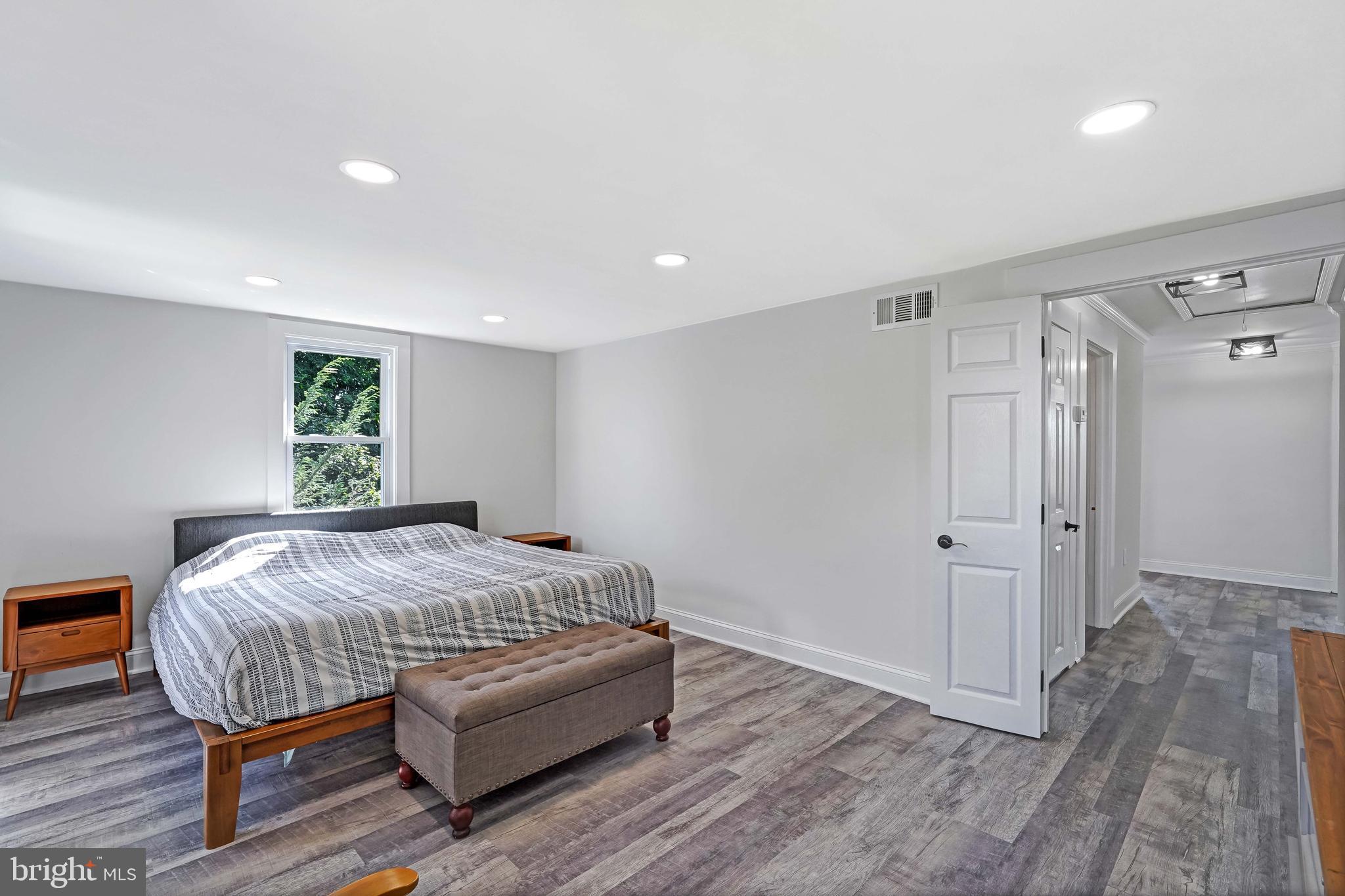 27100 Ridge Road Damascus, MD 20872 - Photo 29 of 74 a bedroom with a bed and a window