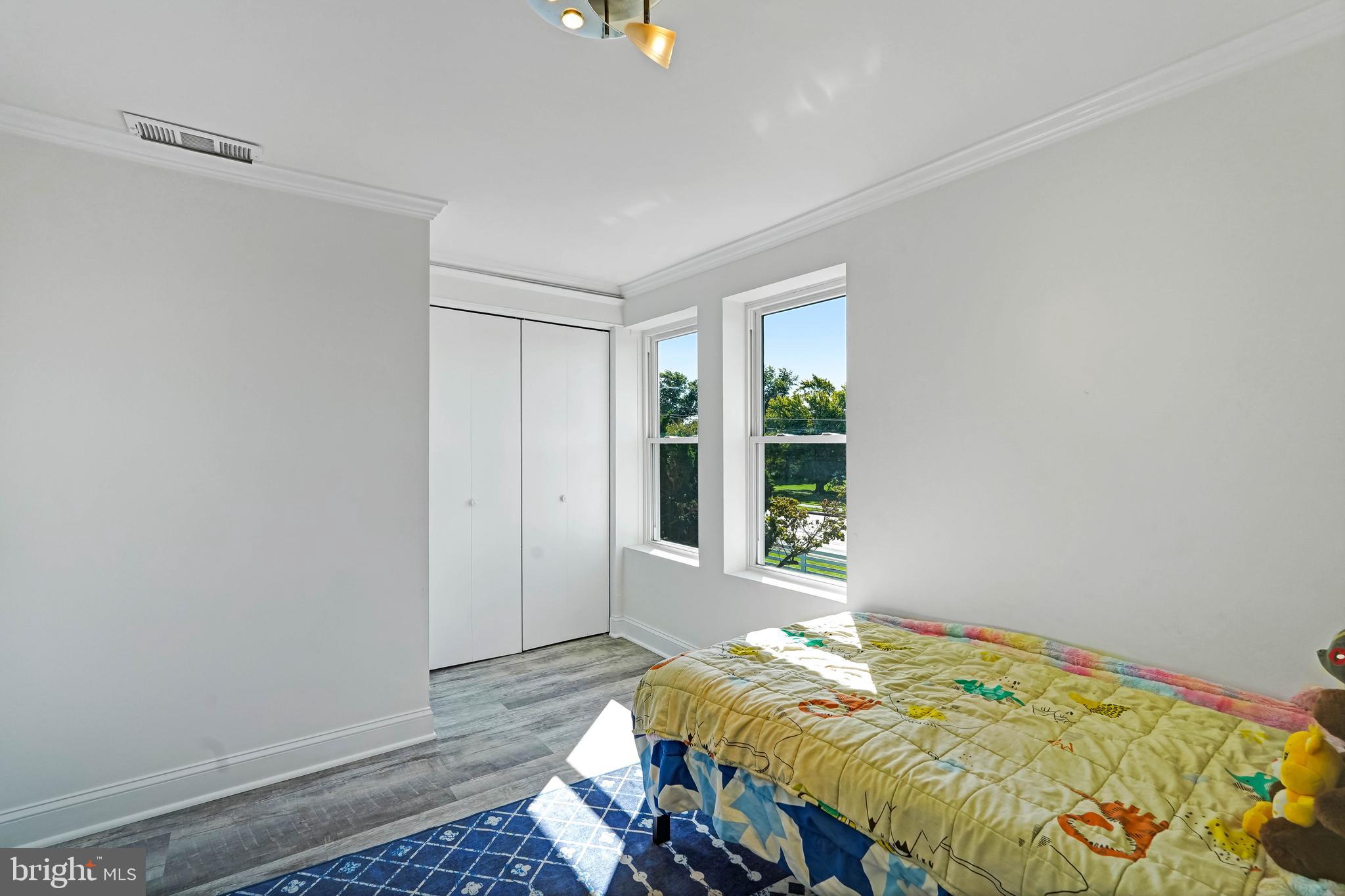 27100 Ridge Road Damascus, MD 20872 - Photo 33 of 74 a bed sitting in a bedroom next to a window