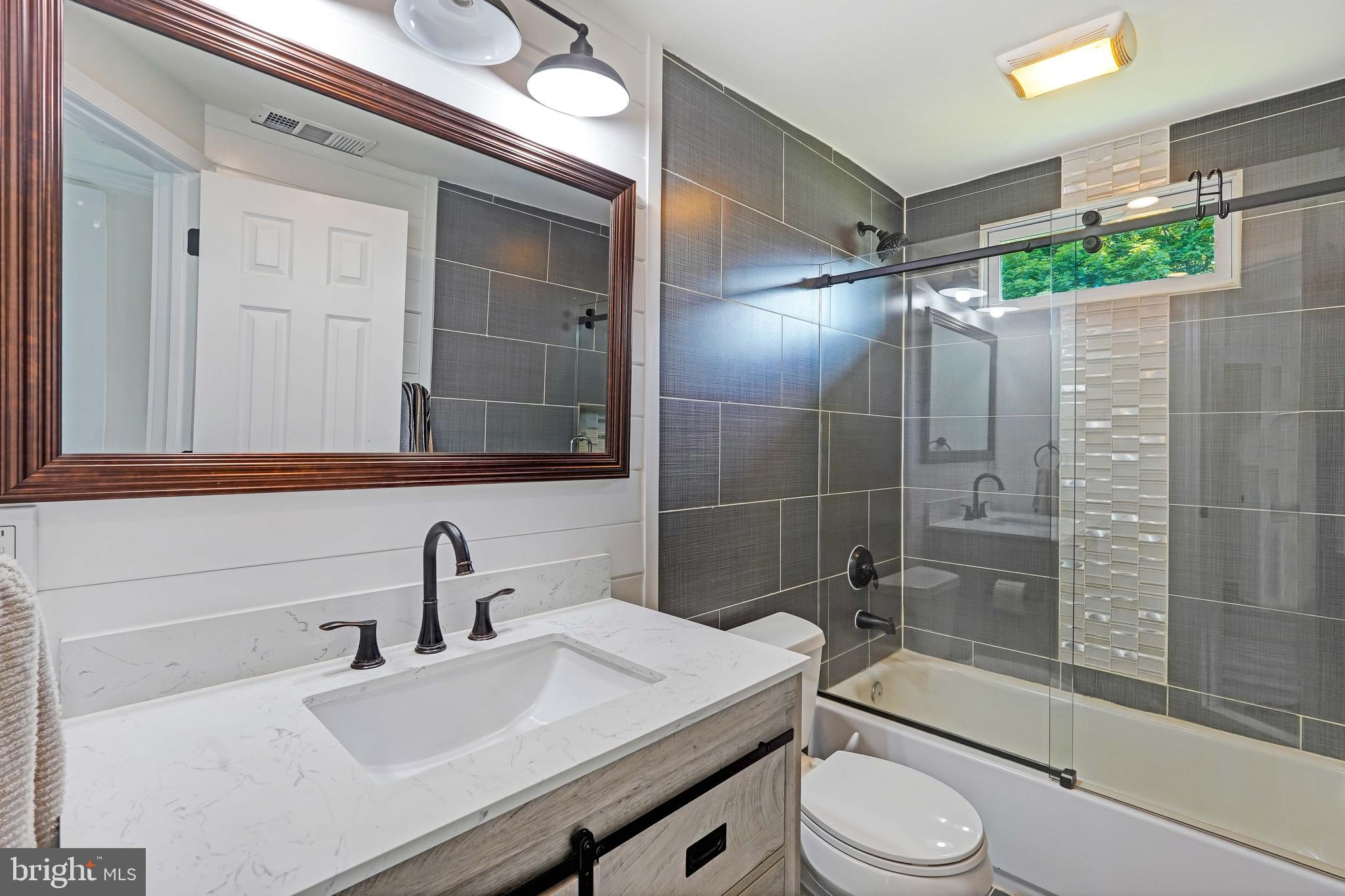 27100 Ridge Road Damascus, MD 20872 - Photo 35 of 74 a bathroom with a sink toilet and shower