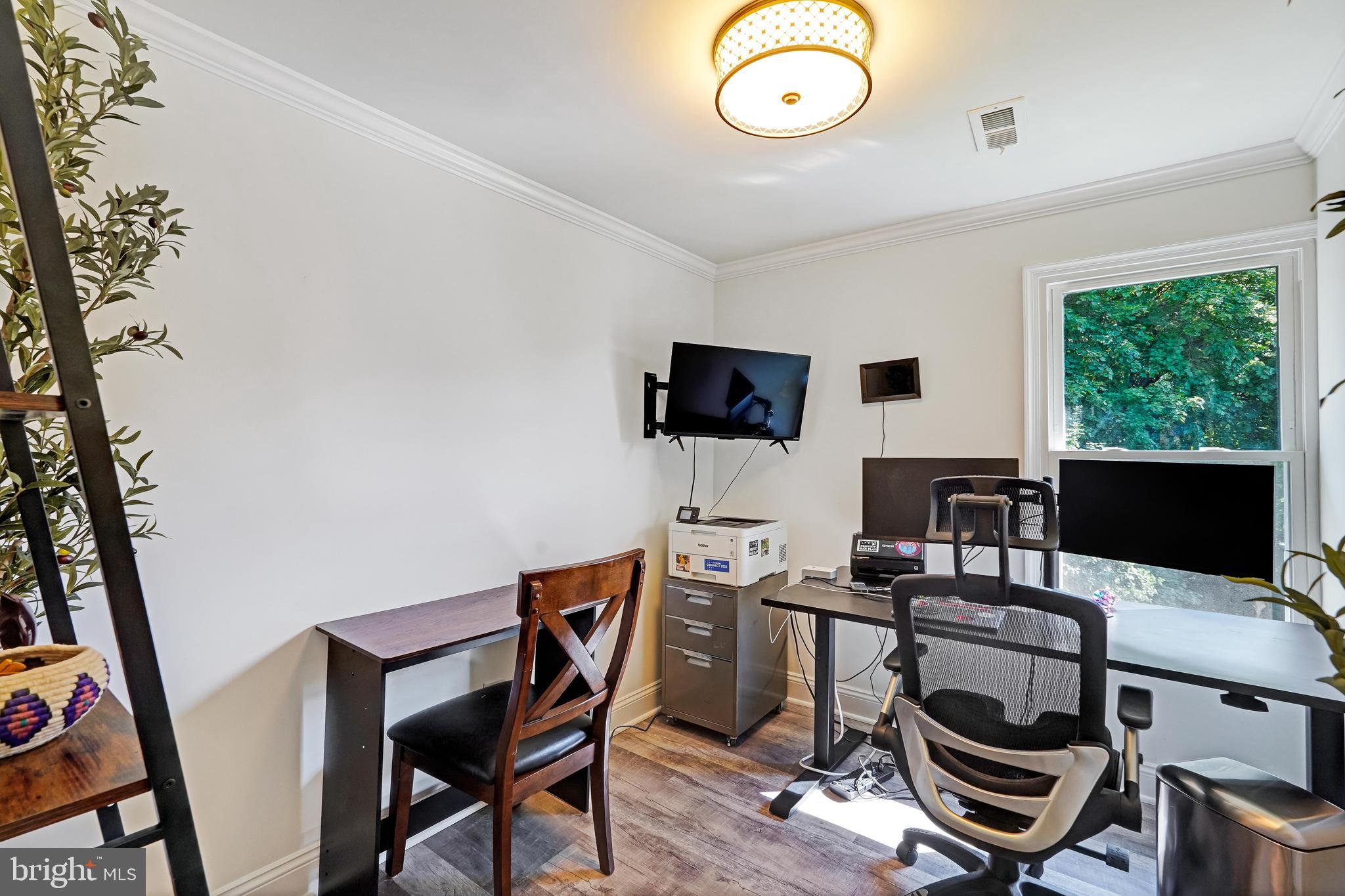27100 Ridge Road Damascus, MD 20872 - Photo 41 of 74 a view of a workspace with furniture and a window