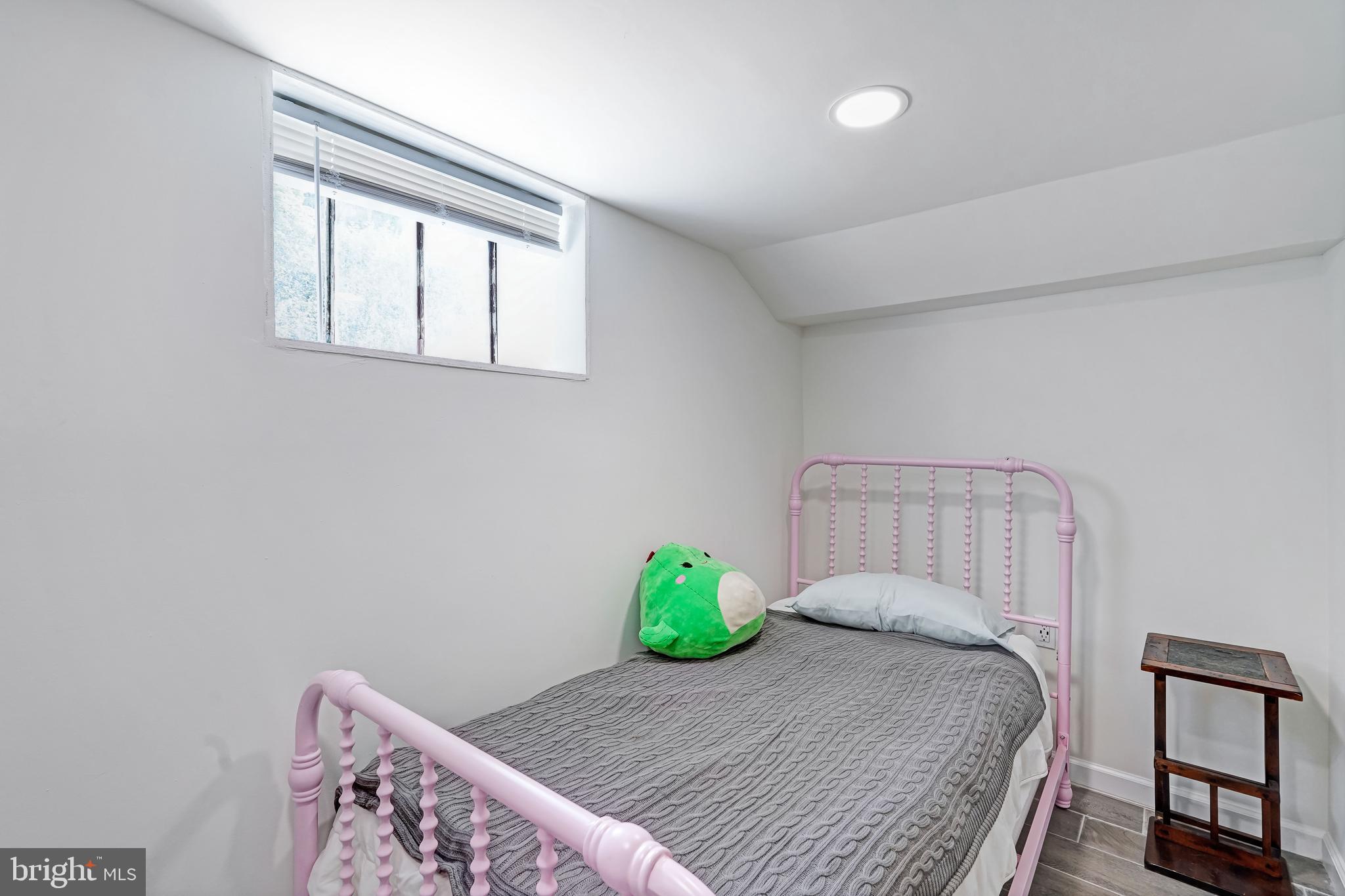 27100 Ridge Road Damascus, MD 20872 - Photo 54 of 74 a bedroom with a bed and a window