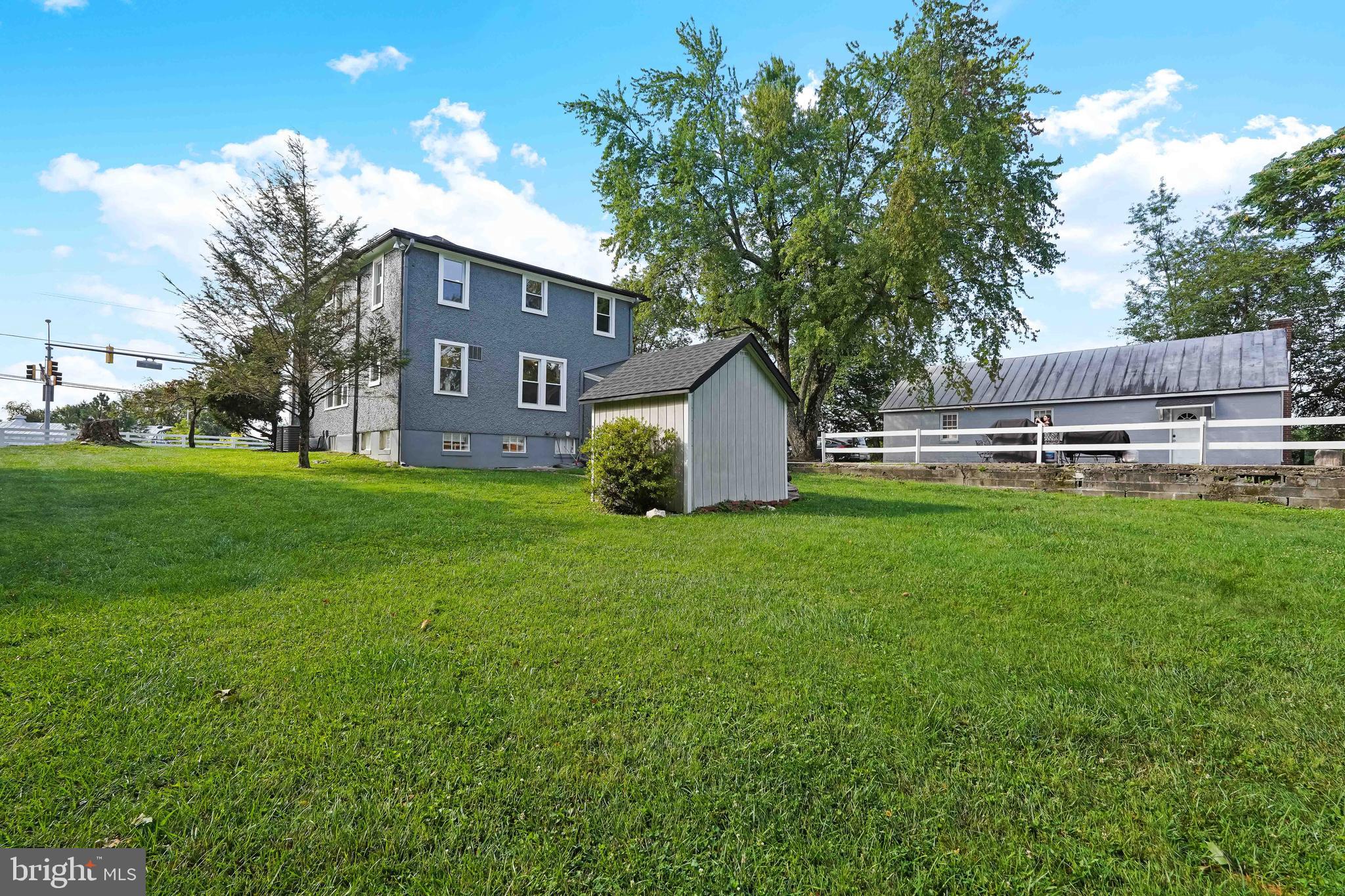27100 Ridge Road Damascus, MD 20872 - Photo 71 of 74 a backyard of a house with table and chairs