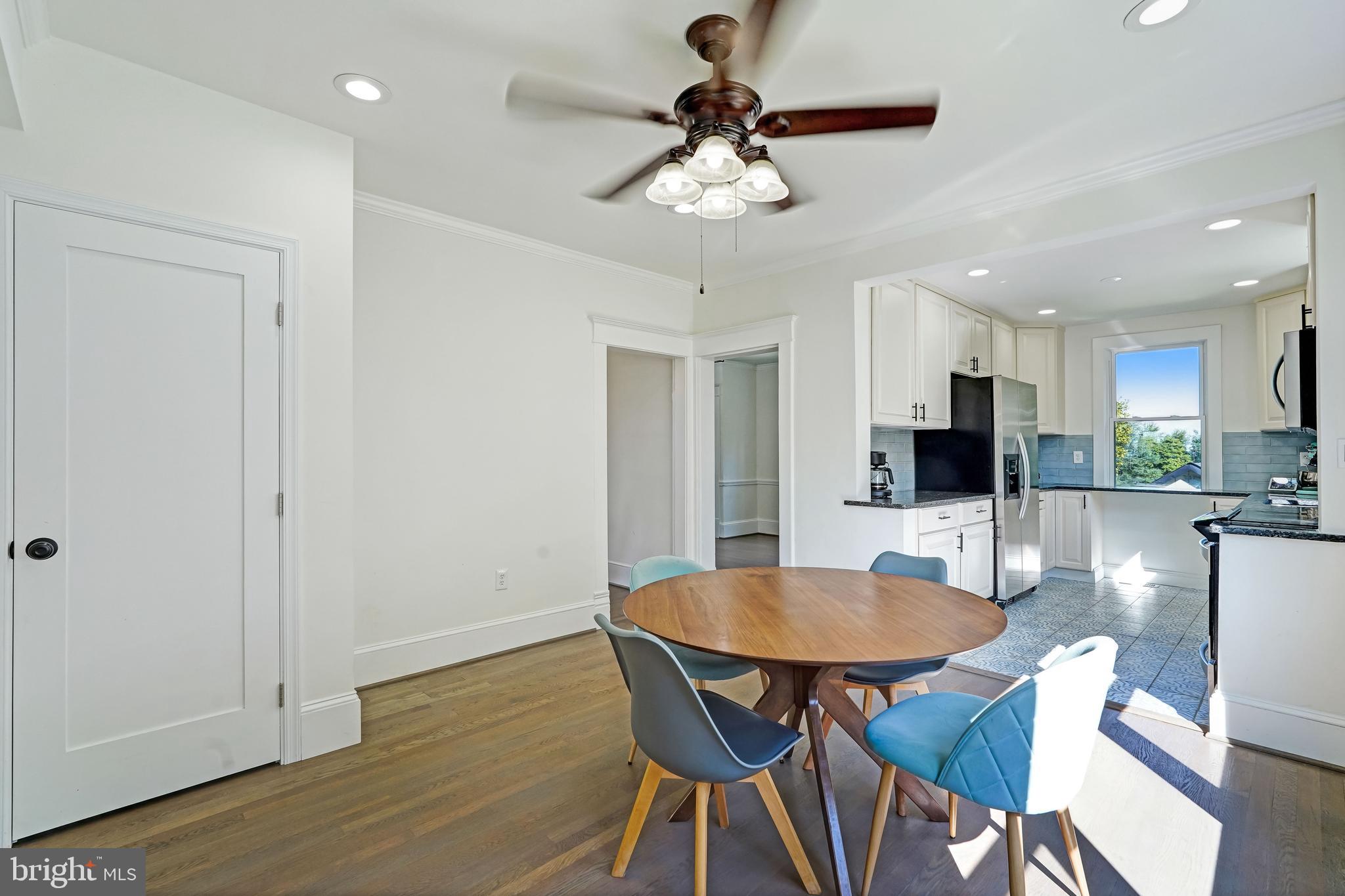 27100 Ridge Road Damascus, MD 20872 - Photo 10 of 74 a view of a dining room with furniture and wooden floor