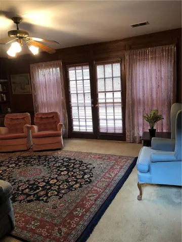 a living room with couch and a window