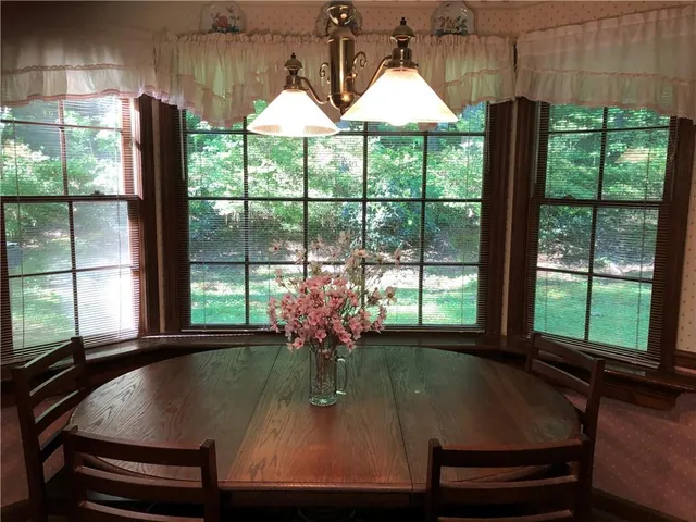 a view of a room with furniture and a window