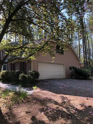 a house view with a backyard space
