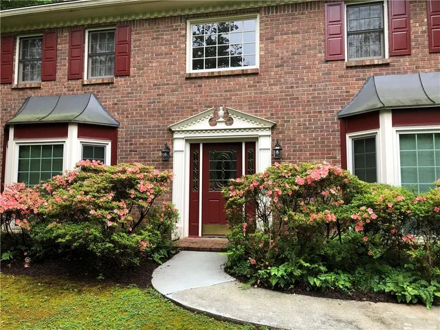 a front view of a house having yard