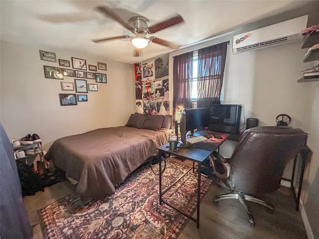 a bed room with a bed and a chair