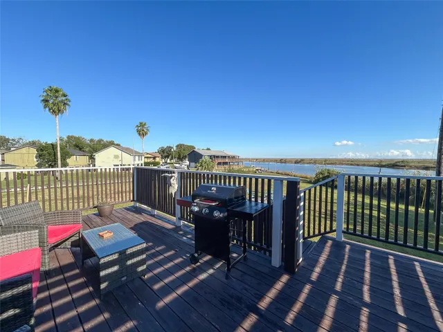 a view of a balcony with wooden floor