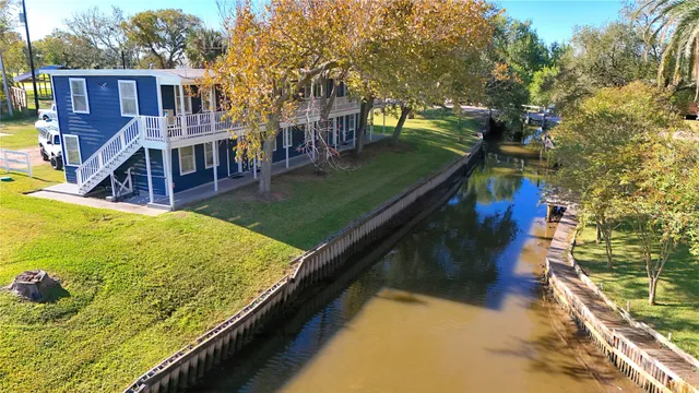 a view of swimming pool with a patio and a yard