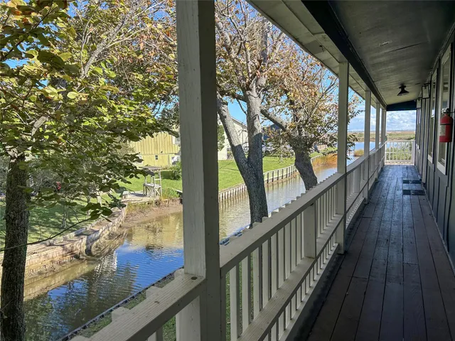 a view of balcony with wooden floor