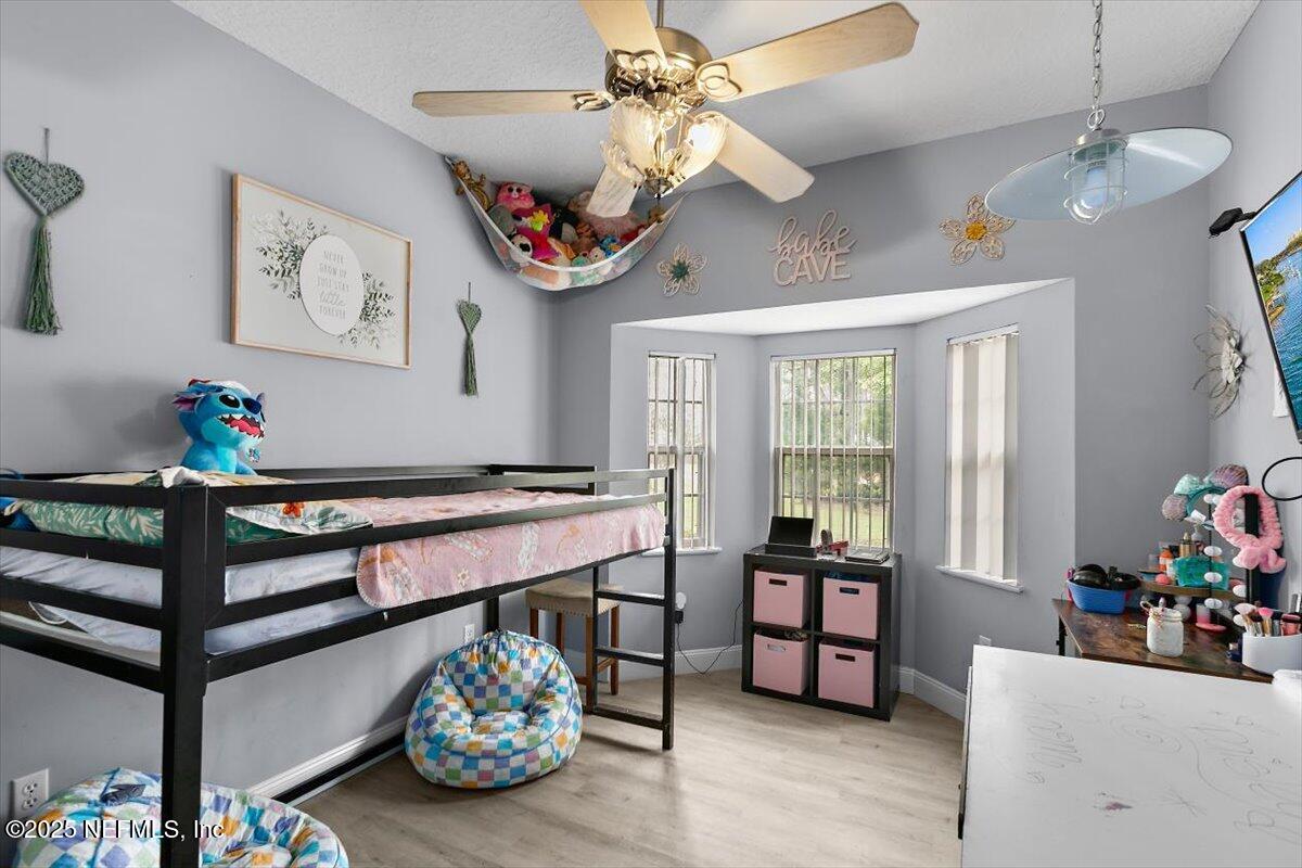 55214 Yellow Jacket Drive Callahan, FL 32011 - Photo 19 of 32 a living room with furniture and a large window