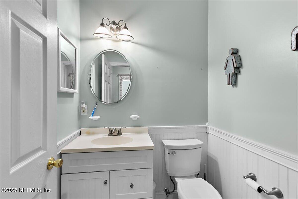 55214 Yellow Jacket Drive Callahan, FL 32011 - Photo 20 of 32 a bathroom with a sink and a mirror