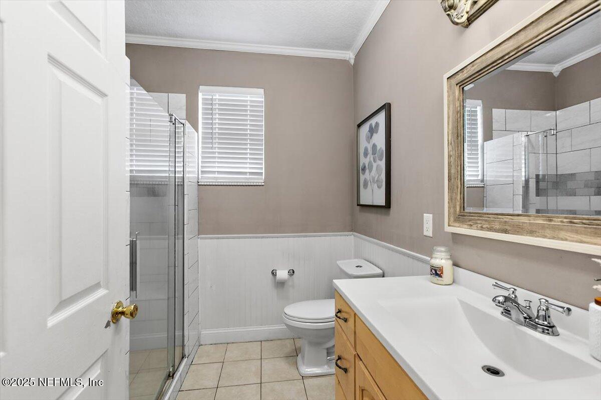 55214 Yellow Jacket Drive Callahan, FL 32011 - Photo 21 of 32 a bathroom with a sink a toilet and shower